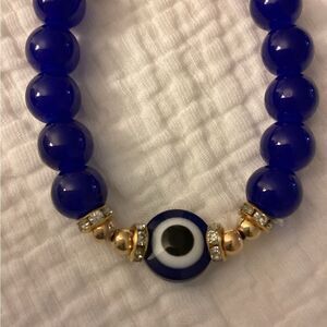 NWT stretch bracelet, Blue, gold, beads, charm eye protection